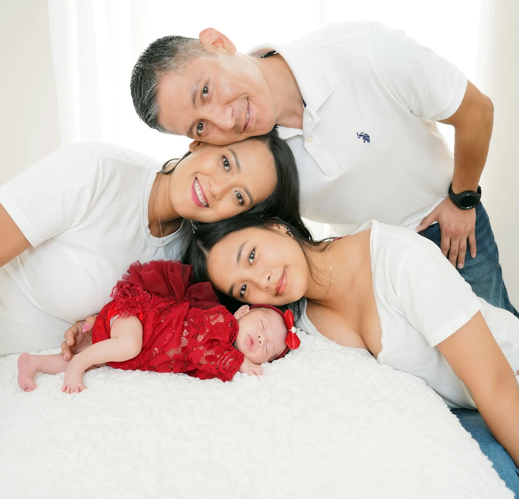 Family portrait with newborn baby and big sister during a photography session at Adrisabel Photography in the Rio Grande Valley